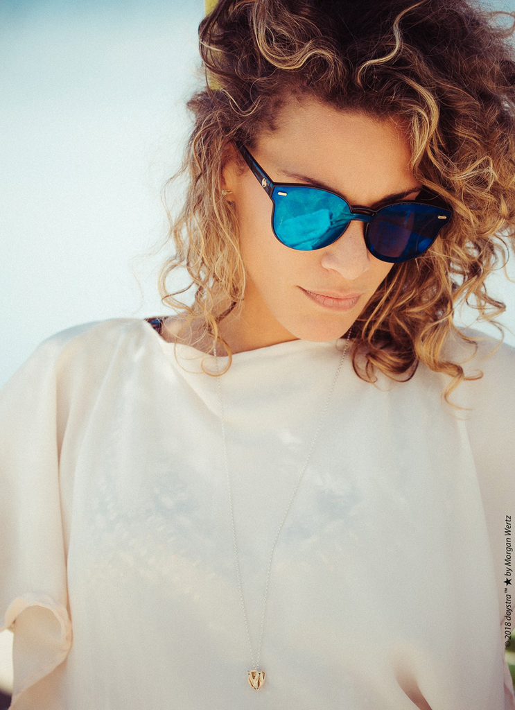 Sea Urchin Mouth necklace worn by girl with sunglasses - Jennifer Kinnear Jewellery