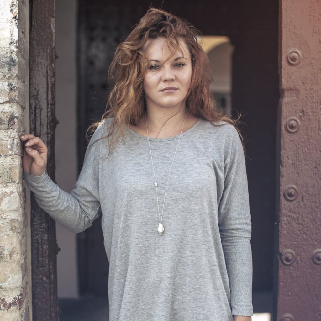 Silver Sea Snail Necklace worn by a girl
