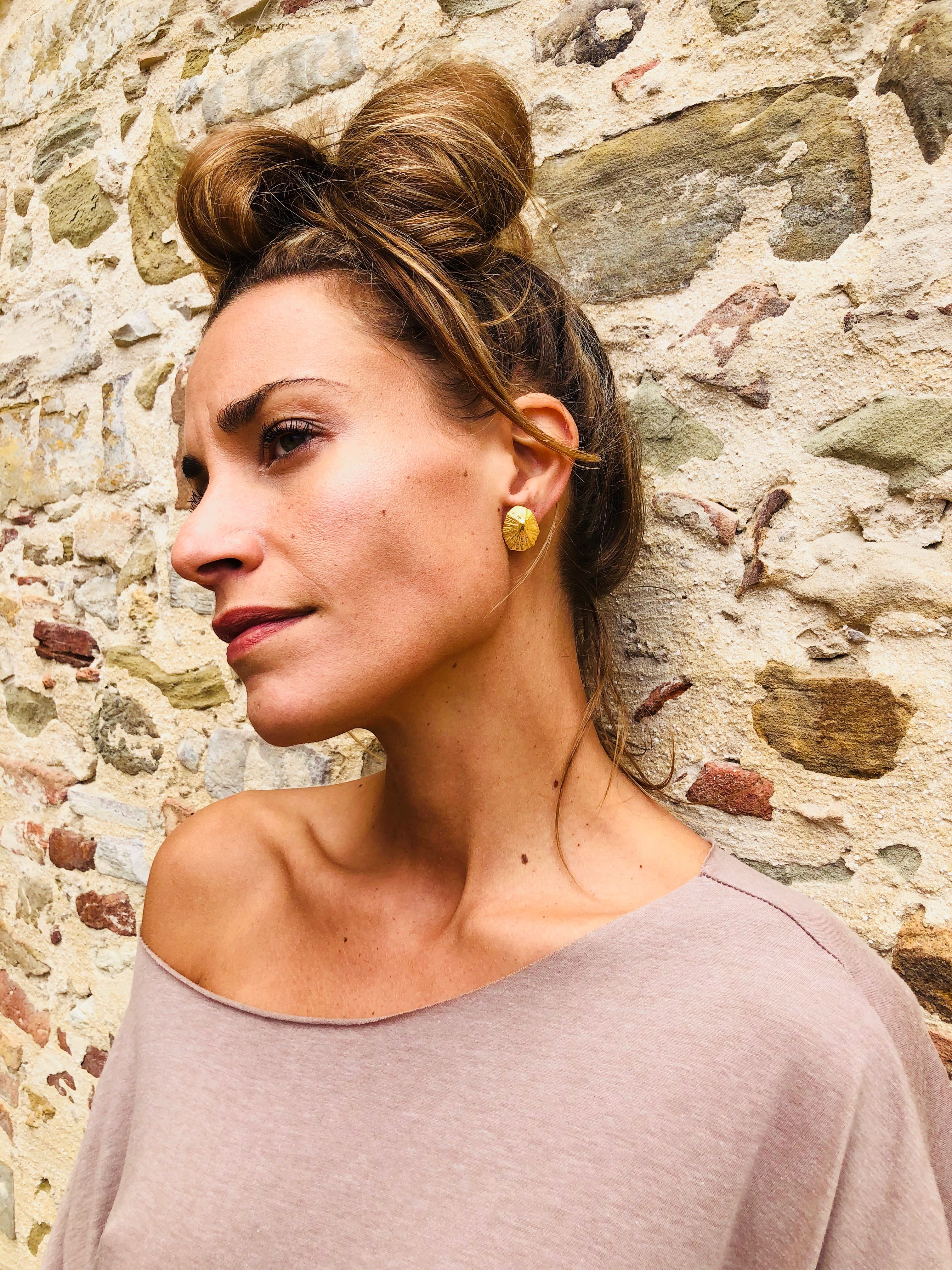 Goldplated Whelk Shell Earrings worn by a model - Ocean Collection - Jennifer Kinnear Jewellery
