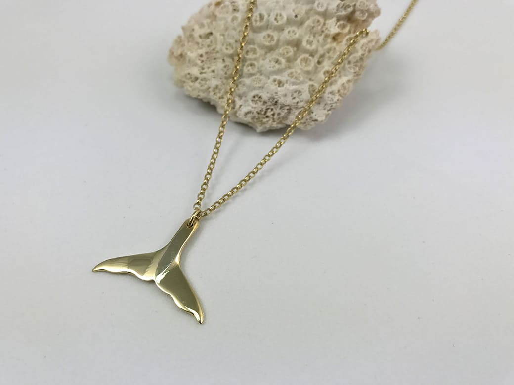 Goldplated Whelk Shell Necklace displayed on a Coral- Ocean Collection - Jennifer Kinnear Jewellery