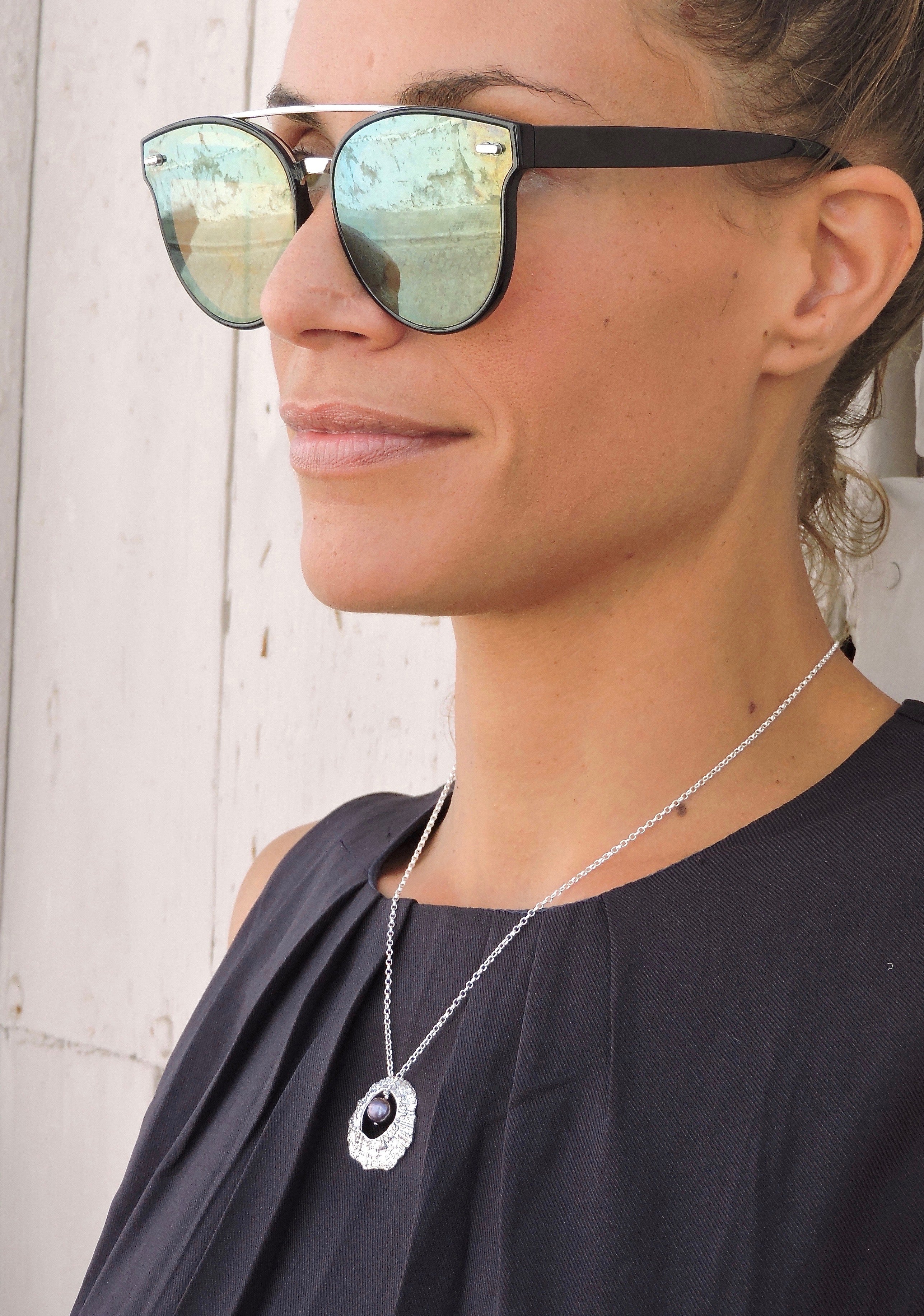 Hollow LIMPET necklace, large - silver - worn by girl - Jennifer Kinnear Jewellery