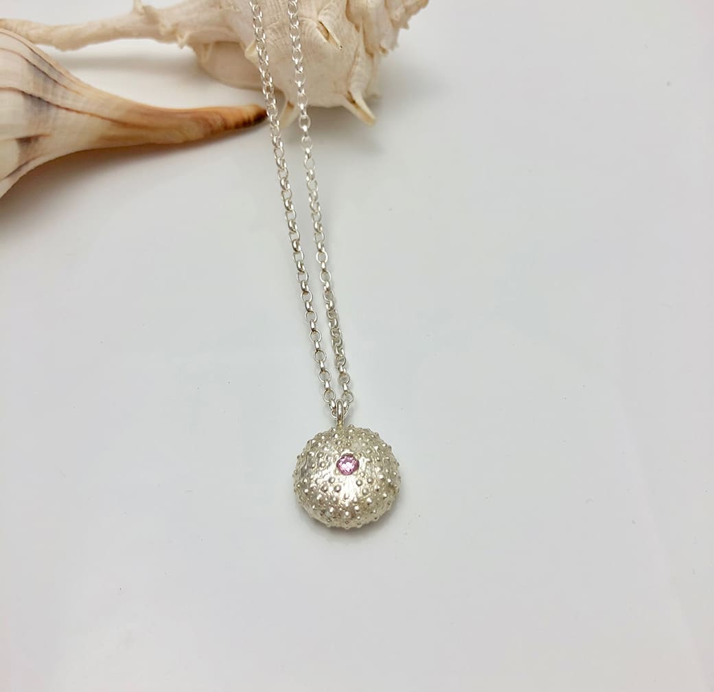 Sea Urchin Necklace displayed on a helk Shell - Ocean Collection - Jennifer Kinnear Jewellery